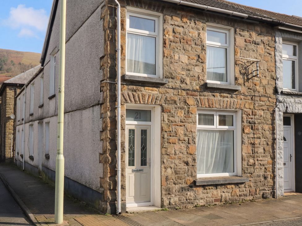 A building with stone facade and windows at Maindy Lodge 