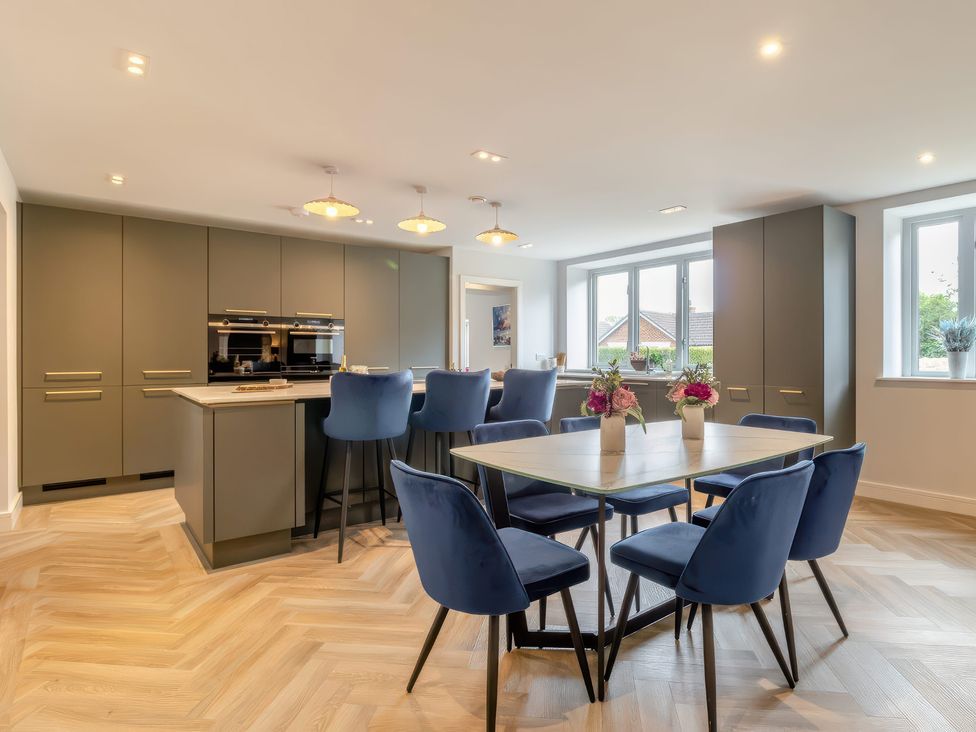A kitchen with a dining area and appliances at The Old Butchers Arms in Sheffield
