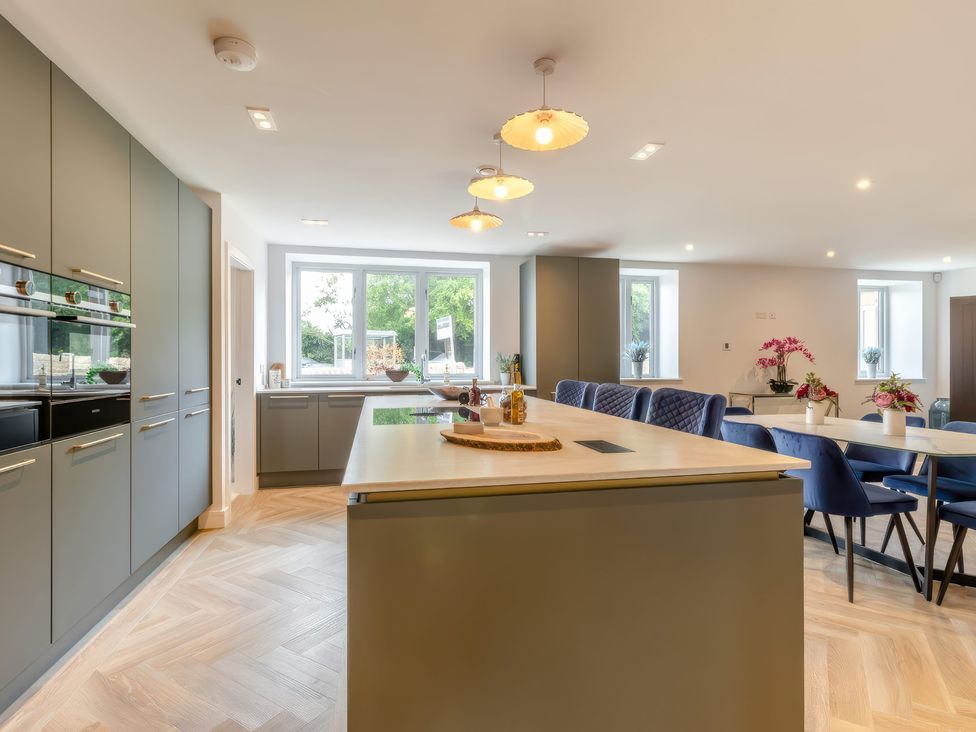 A kitchen with cabinets and an island countertop at The Old Butchers Arms in Sheffield