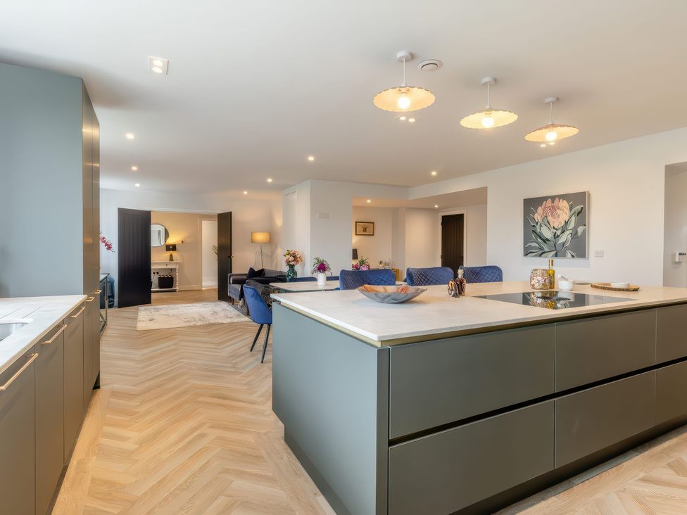 A kitchen with an island and dining area at The Old Butchers Arms in Sheffield