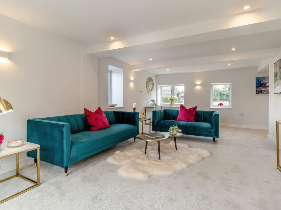 A living room with sofas and a coffee table at The Old Butchers Arms in Sheffield