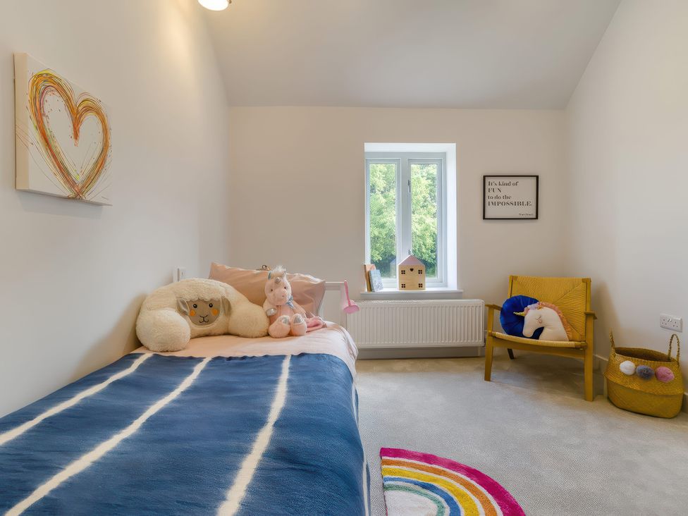 A bedroom with a bed and decorative items at The Old Butchers Arms in Sheffield