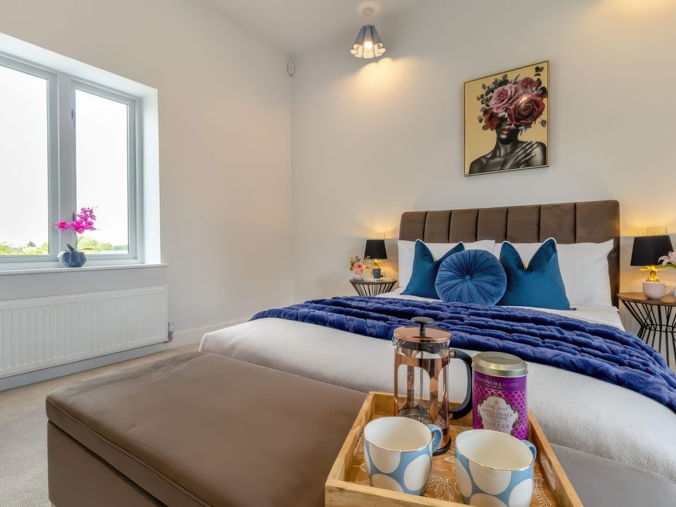A bedroom with a bed and window at The Old Butchers Arms in Sheffield