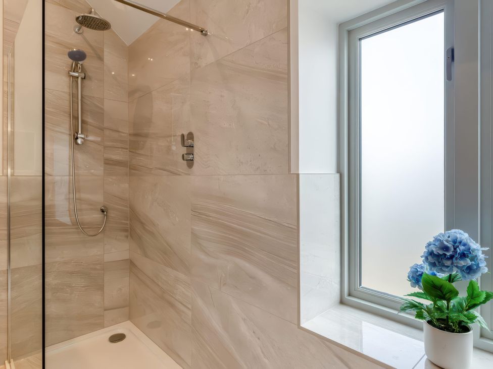 A shower with a window and a flower pot at The Old Butchers Arms in Sheffield