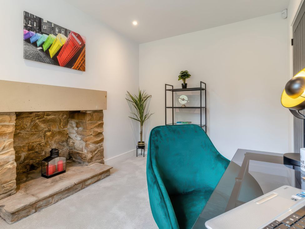 An office with a fireplace and desk at The Old Butchers Arms in Sheffield