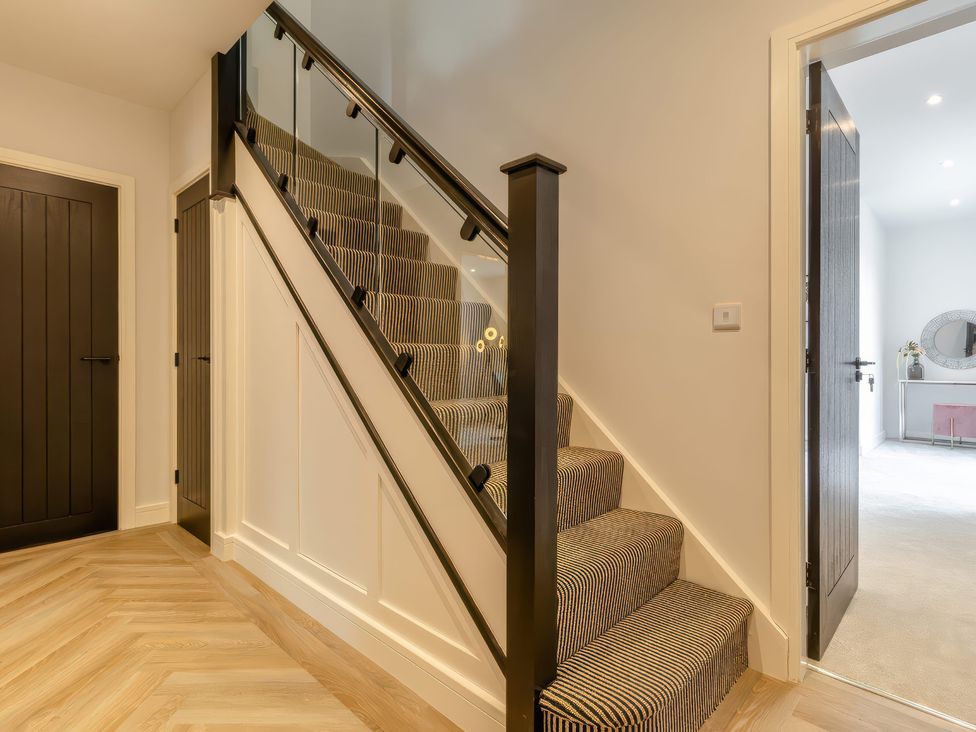 A staircase and door in a hallway at The Old Butchers Arms in Sheffield