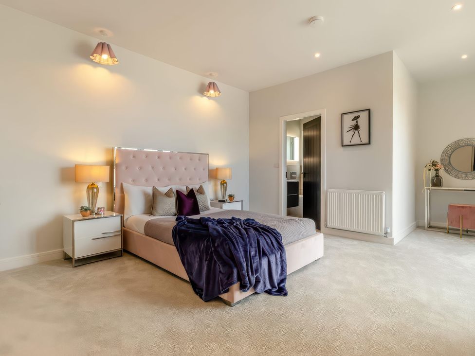 A bedroom with a bed and bedside tables at The Old Butchers Arms in Sheffield