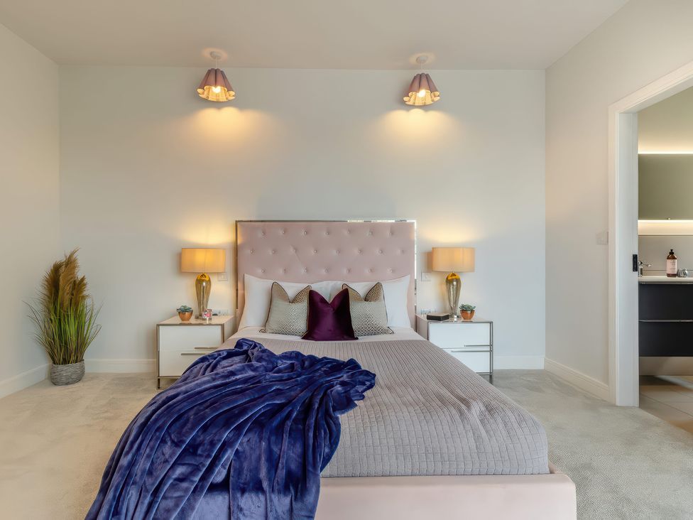 A bedroom with a bed and nightstand at The Old Butchers Arms in Sheffield