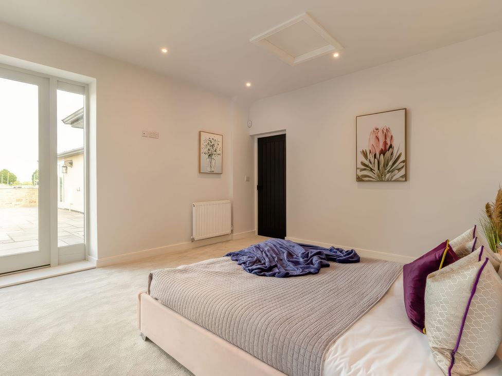 A bedroom with a bed and blankets at The Old Butchers Arms in Sheffield