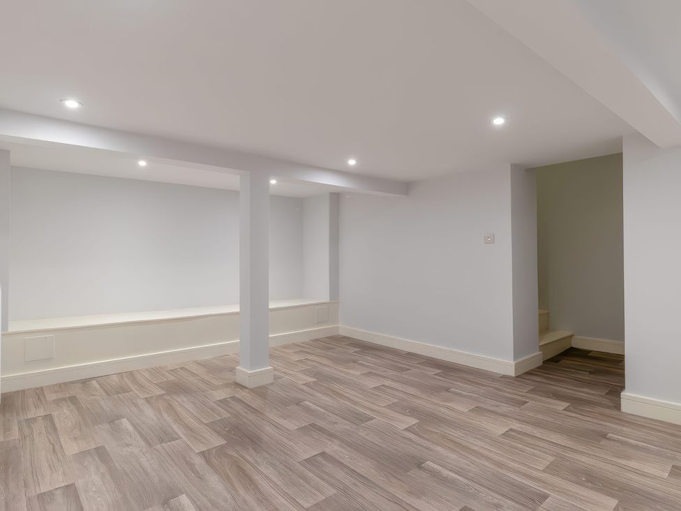 A basement with wood flooring and steps at The Old Butchers Arms in Sheffield