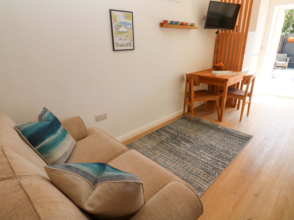 A dining room with a table and chairs at Carn Brea Redruth