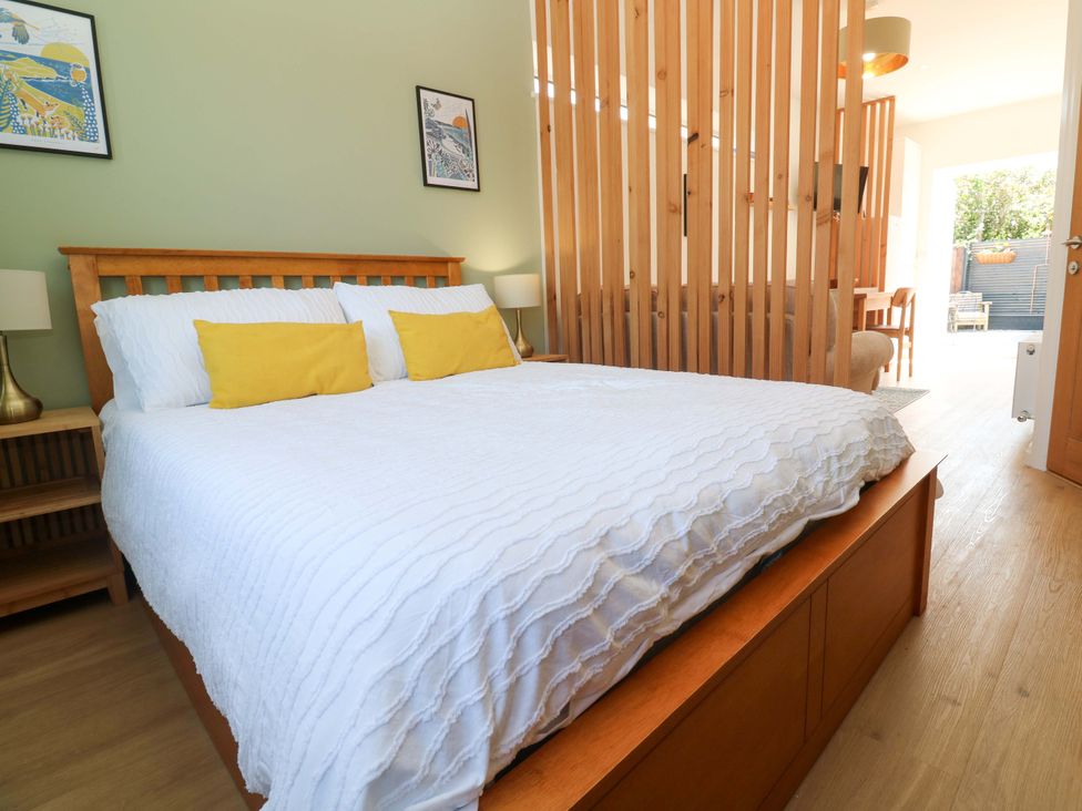 A bedroom with a bed and bedside tables at Carn Brea in Redruth