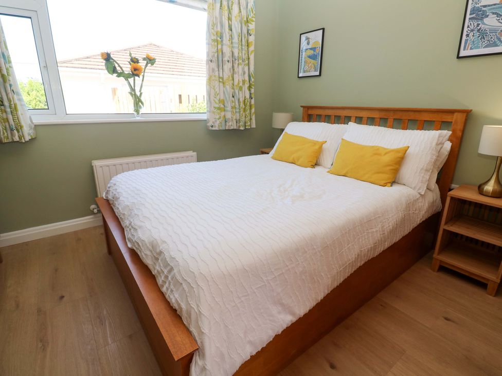 A bedroom with a bed and nightstand at Carn Brea in Redruth