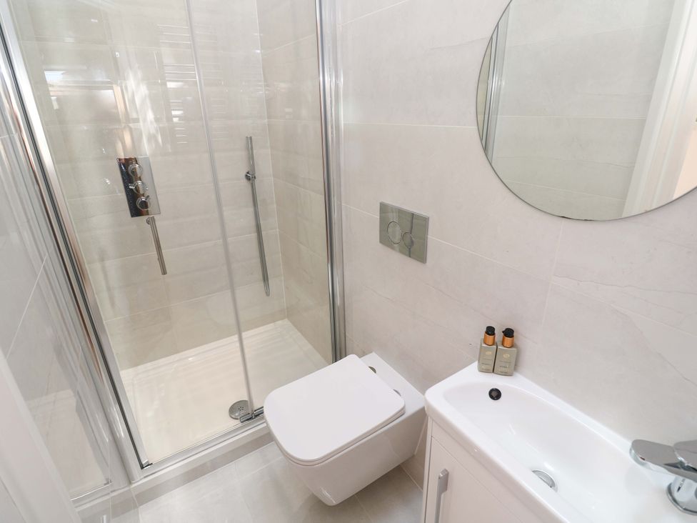 A bathroom with a shower and toilet at Carn Brea in Redruth