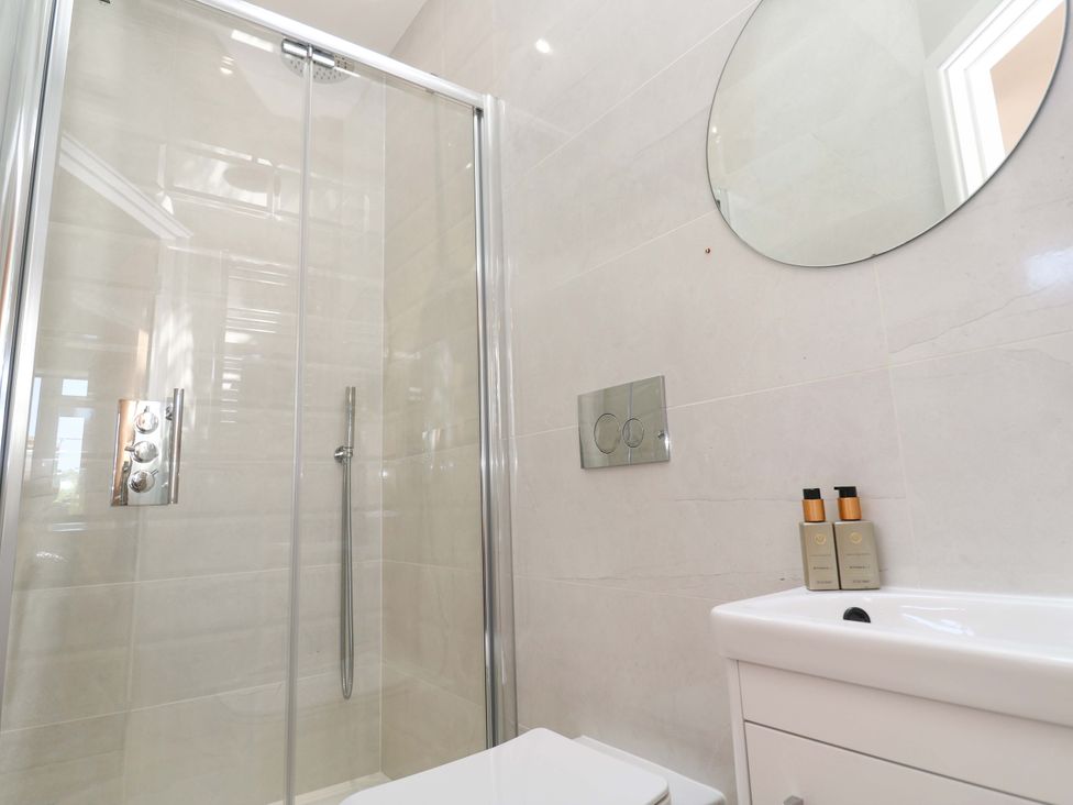 A bathroom with shower, toilet, and sink at Carn Brea in Redruth