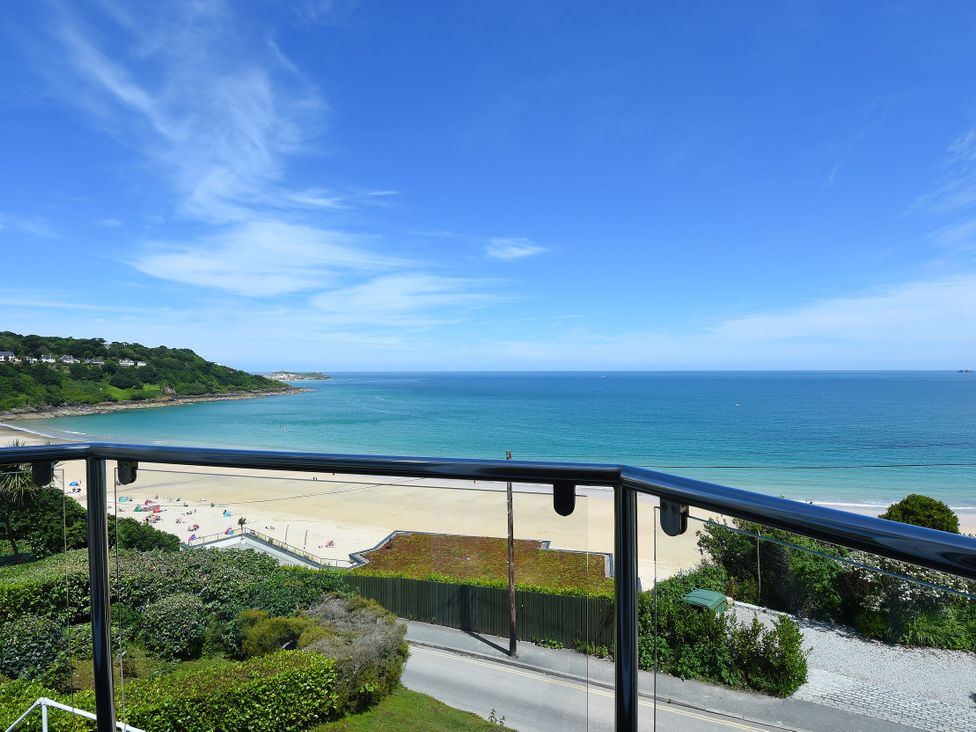 A view of the beach and sea from a balcony at Carn Brea in Redruth