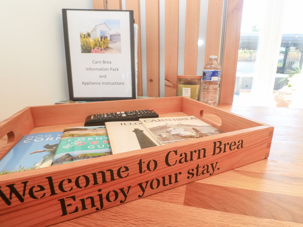 A welcome tray with books and a remote control at Carn Brea in Redruth