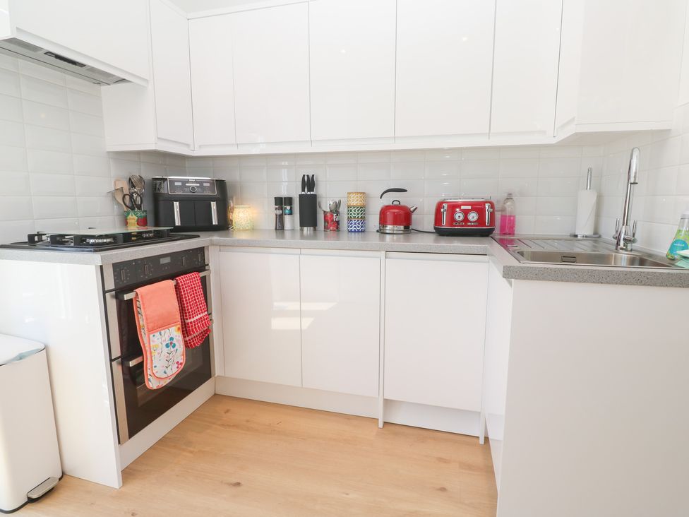 A kitchen with appliances and utensils at Carn Brea in Redruth