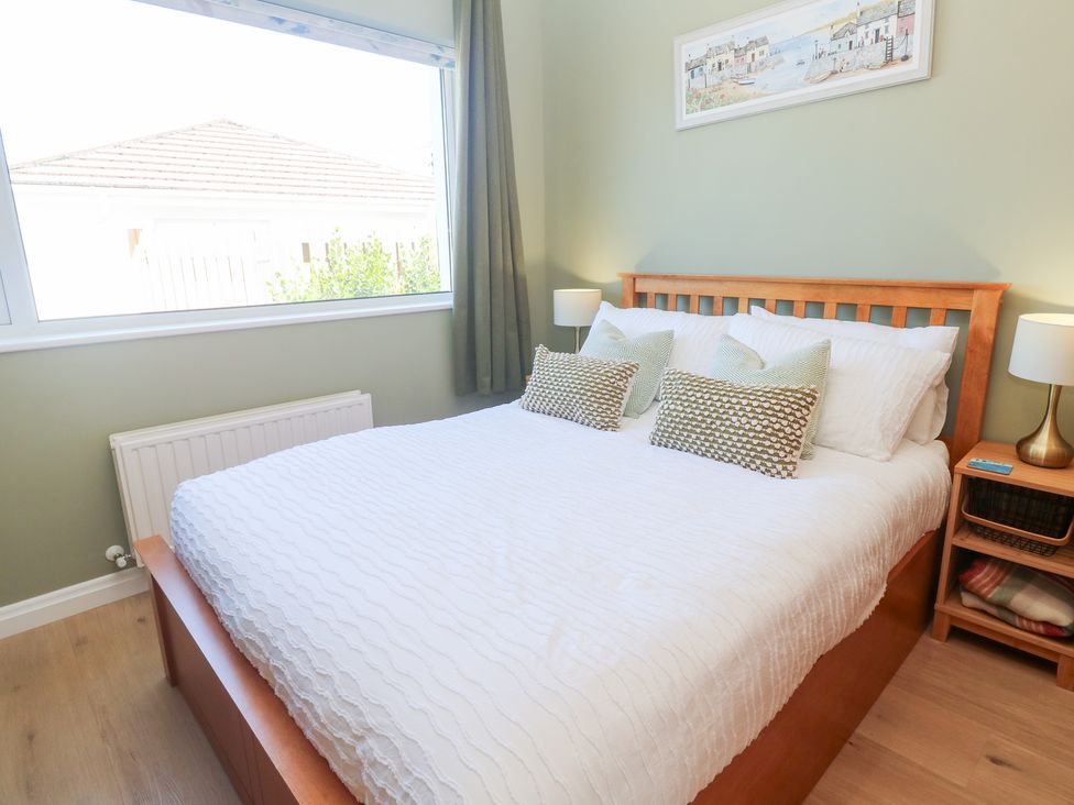 A bedroom with a bed and bedside lamps at Carn Brea in Redruth
