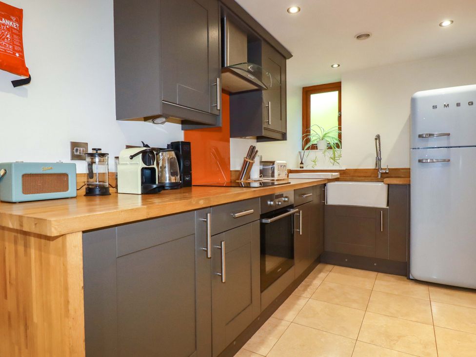 A kitchen with modern appliances and cabinetry at 3 The Old Cornstore