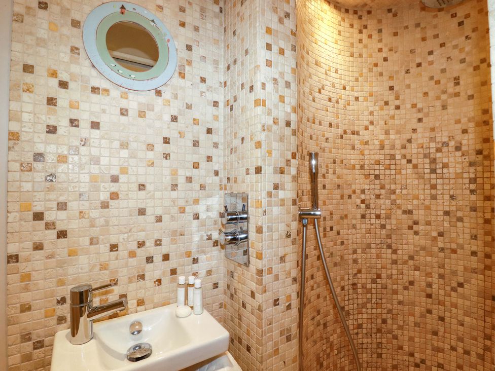 A bathroom with a shower and sink at 3 The Old Cornstore in 