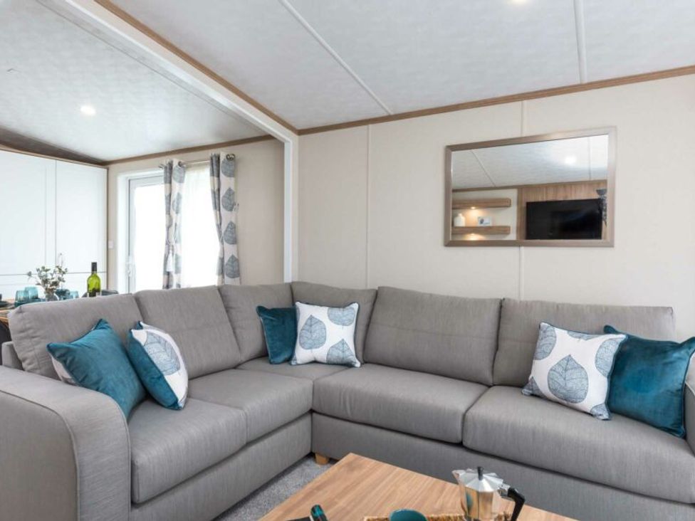 A living room with a sofa and coffee table at Aquadrome Abode 3bed - Billing Aquadrome