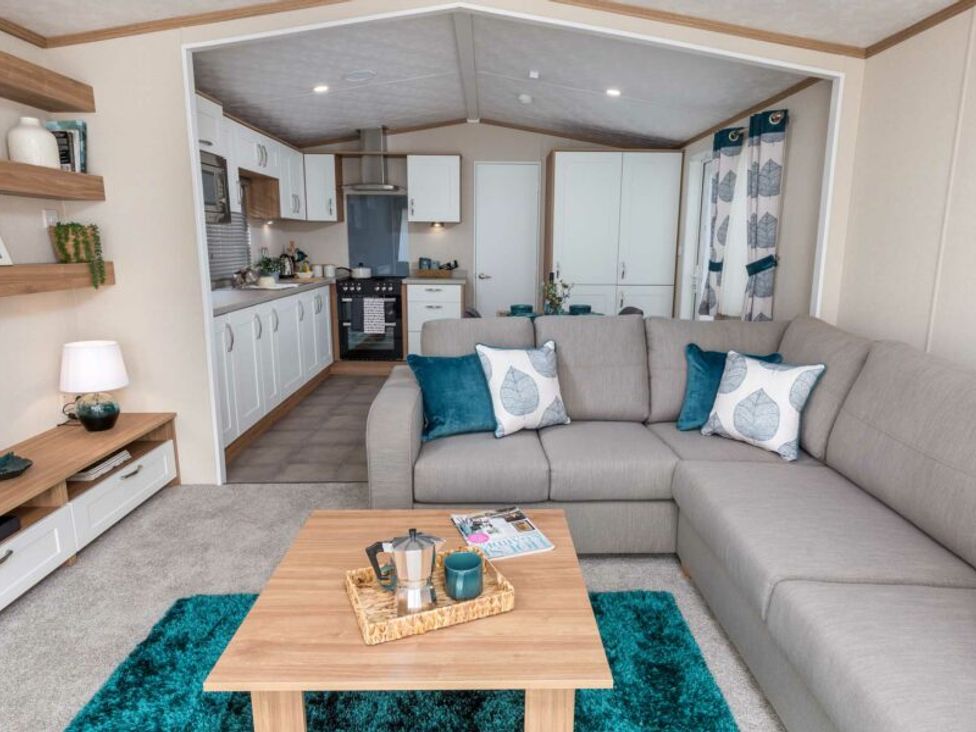 A living room with a sofa and coffee table at Aquadrome Abode 3bed - Billing Aquadrome