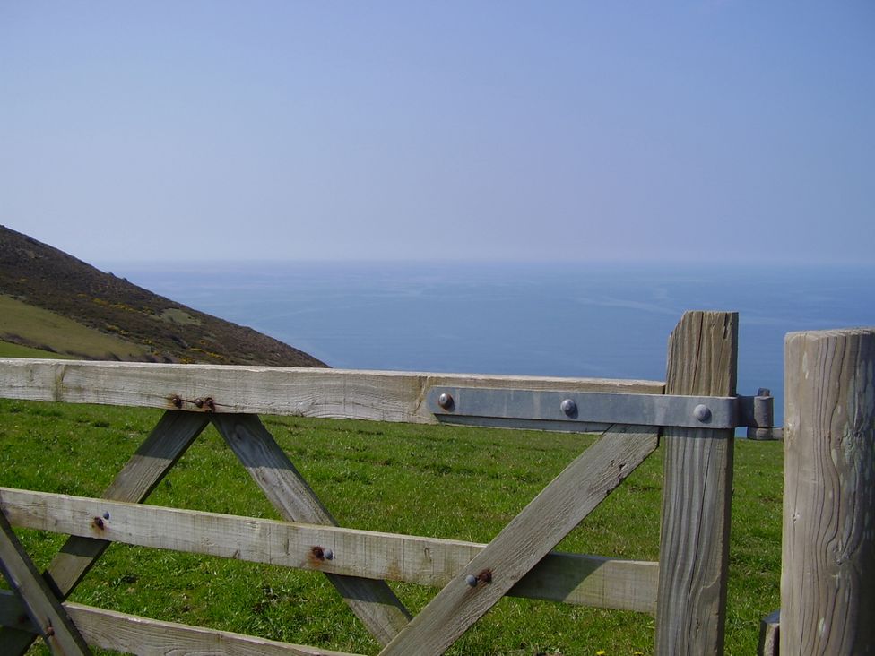 A wooden gate overlooking the sea at Trevean in Crackington Haven