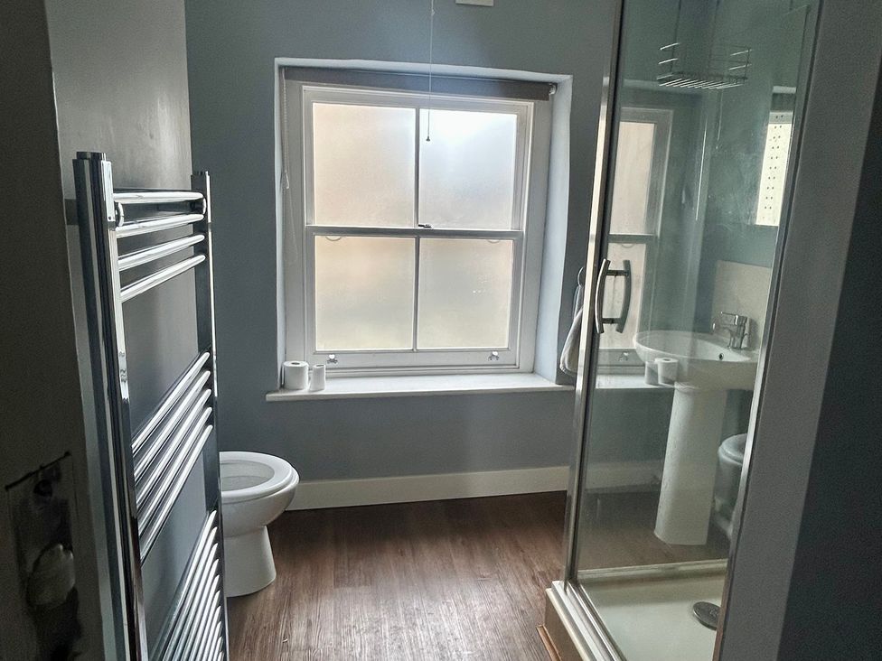 A bathroom with a shower and sink at Mallow Cottage in Langton Matravers