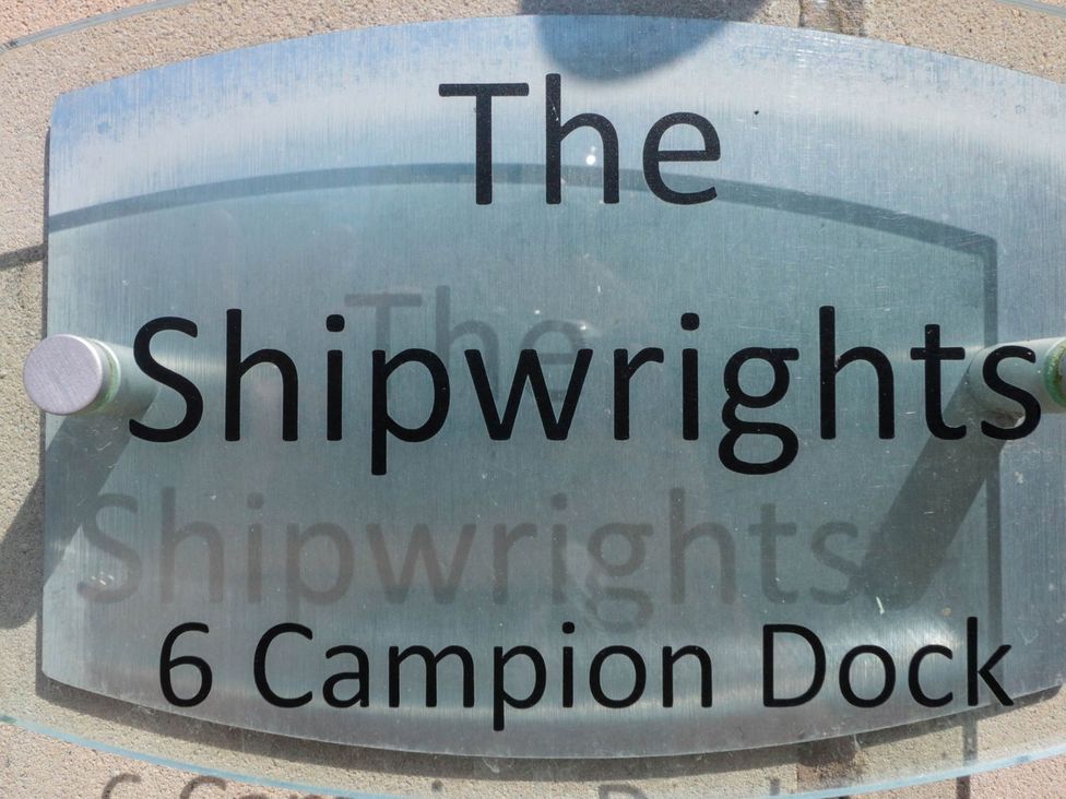 A sign indicating The Shipwrights at 6 Campion Dock in Whitby