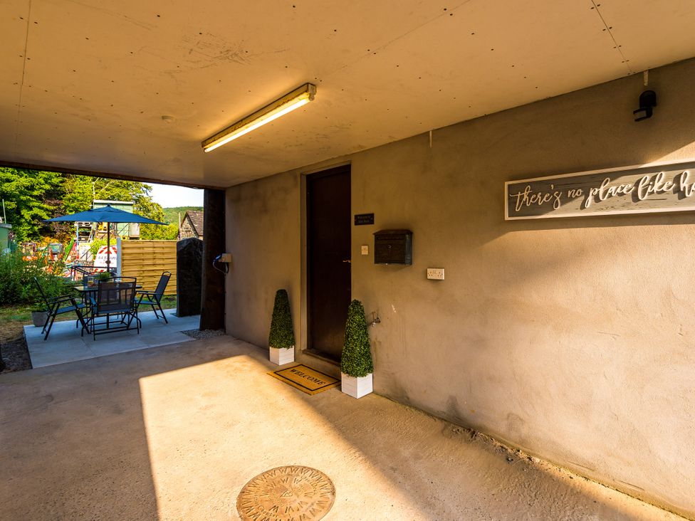 An entrance area with a door and a seating arrangement at Idris Barn Dolgellau