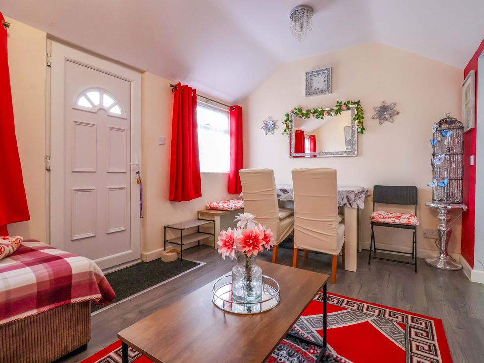 A dining room with a table and chairs at Chalet 231 in Bridlington