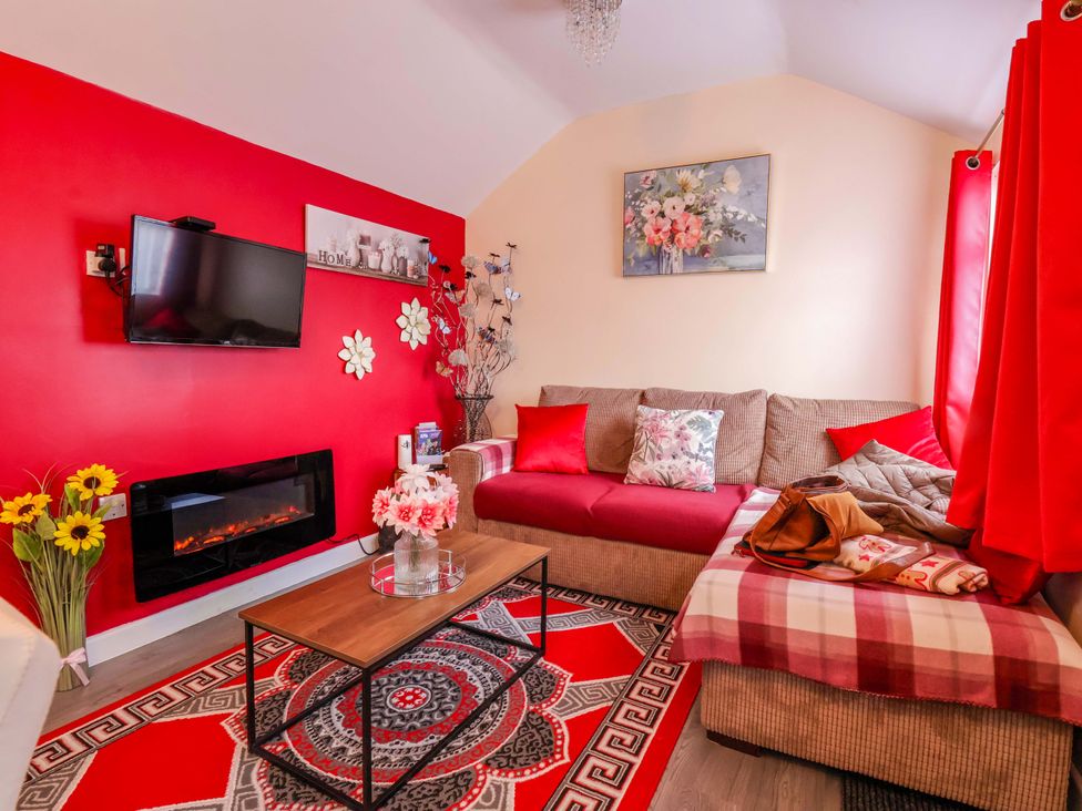 A living room with a sofa and coffee table at Chalet 231 in Bridlington