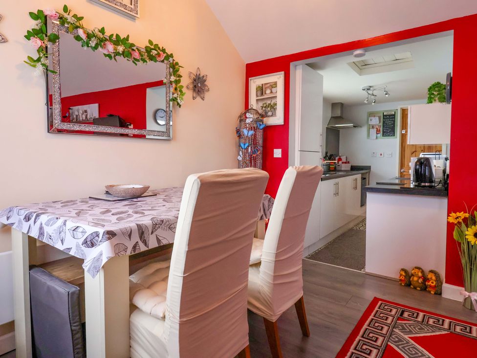 A dining room with a table and chairs at Chalet 231 in Bridlington