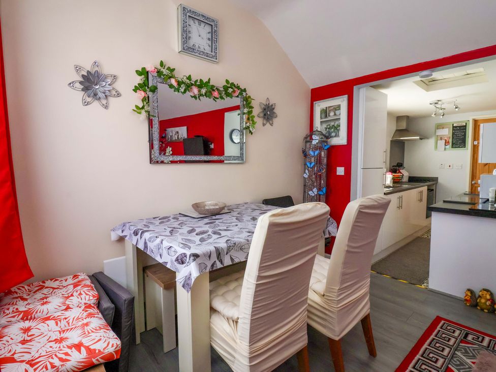 A dining room with a table and chairs at Sandbay in Bridlington