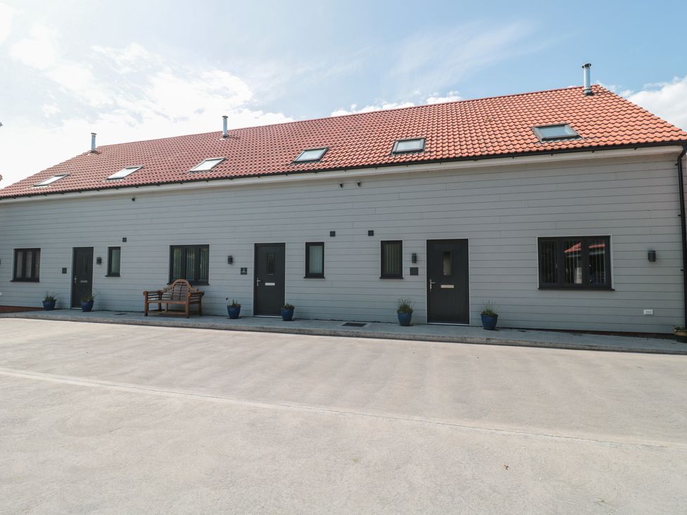 An outdoor view of a building with multiple entrances at 1 The Stables Highbridge