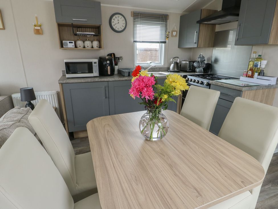 A dining room with a table and chairs at No.22 