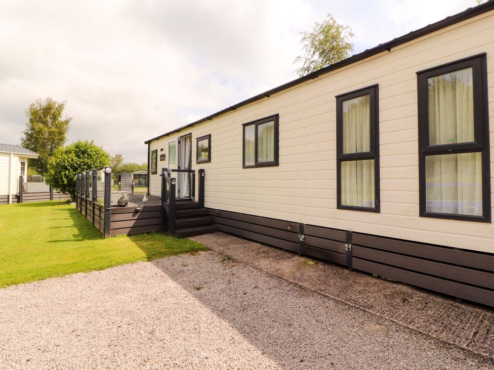 A mobile home with garden area at 22 Yealand in Carnforth