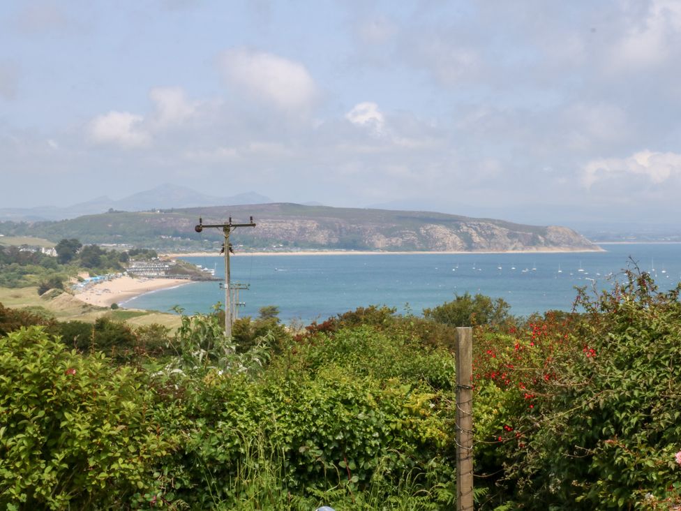 A view of beach and water with boats at Hafan Bach in Abersoch