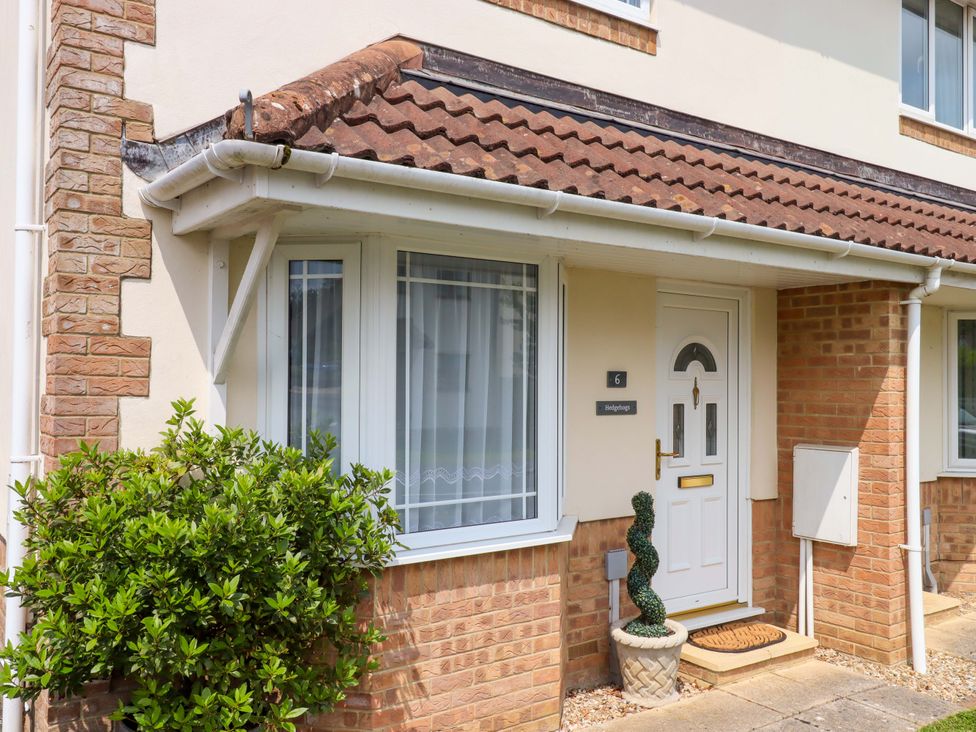 A front entrance with a door and window at Hedgehogs in Barnstaple