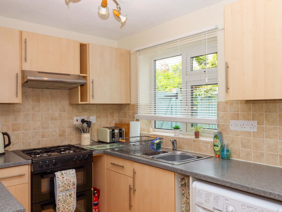 A kitchen with a sink and stove at Hedgehogs Barnstaple