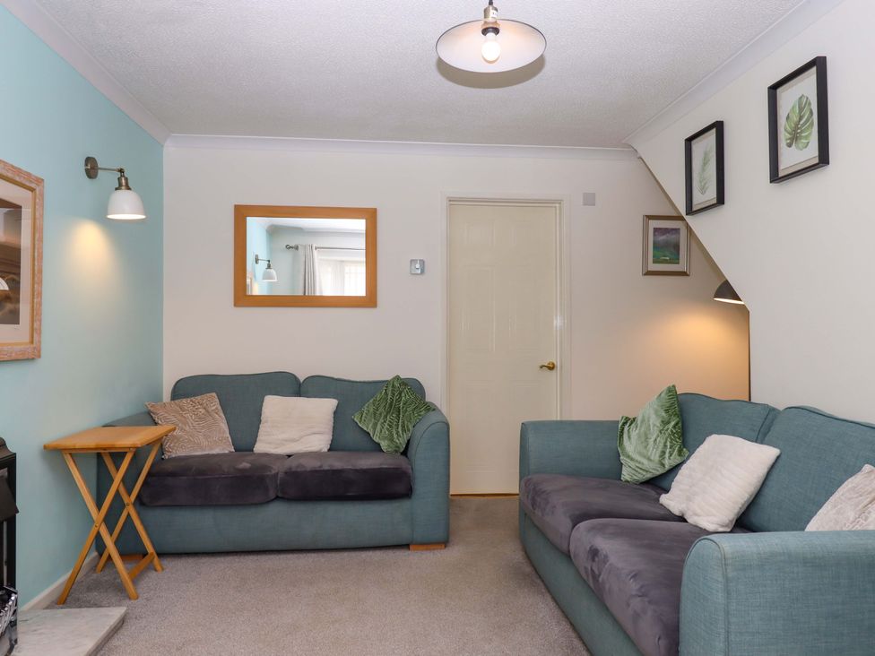 A living room with sofas and a coffee table at Hedgehogs in Barnstaple