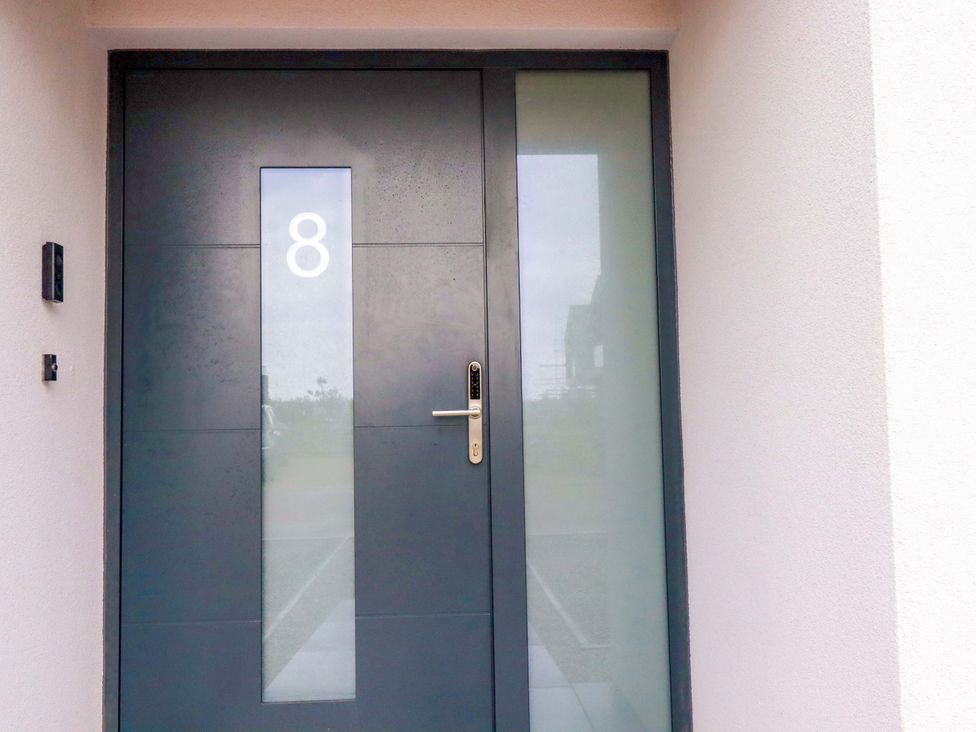A door with number 8 at 8 Karn Havos St. Eval near Mawgan Porth