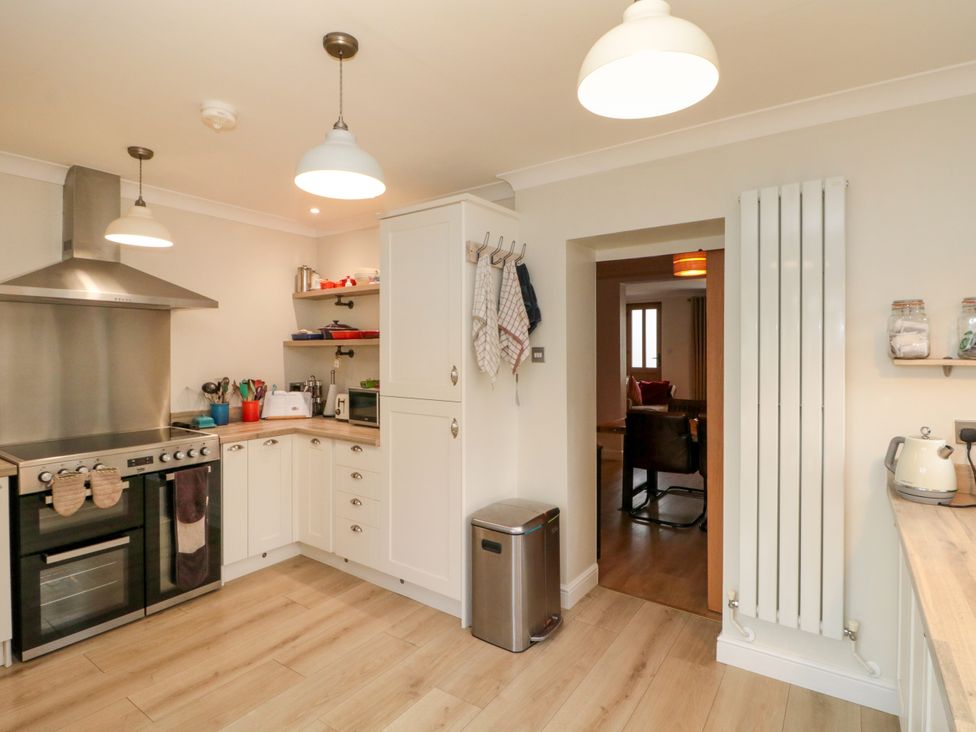 A kitchen with appliances and utensils at No.64 Nelson St in Bridlington