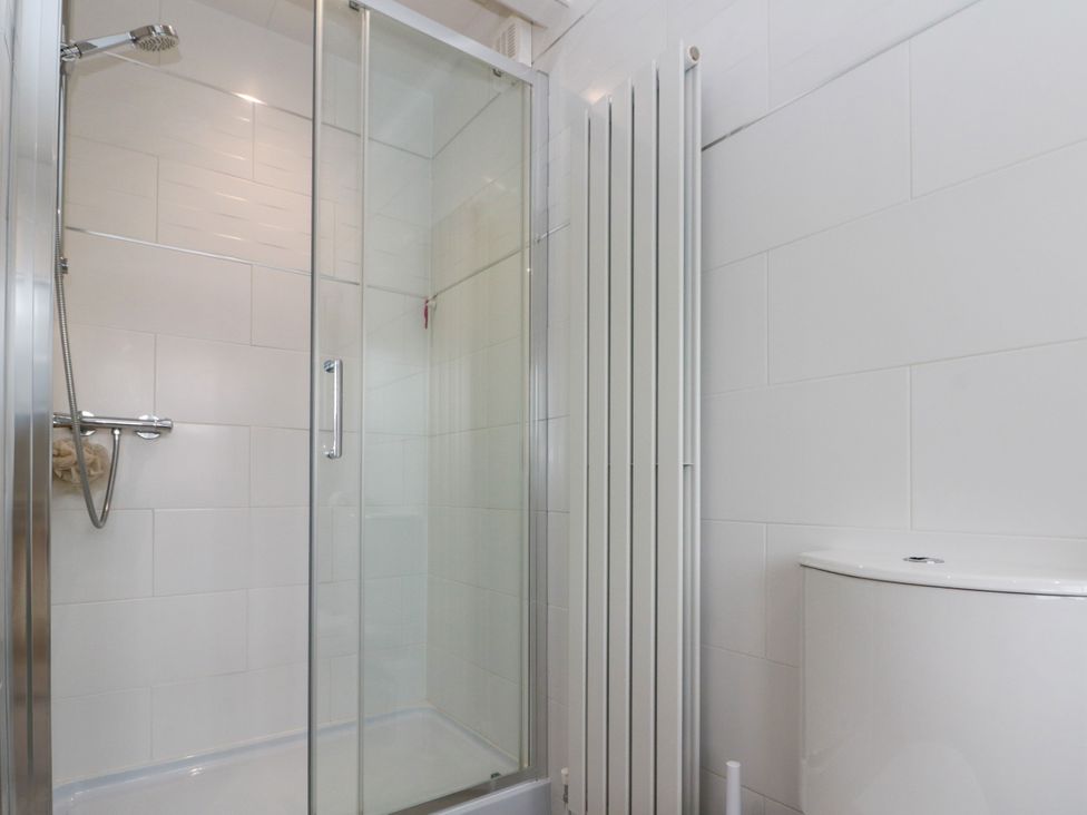 A bathroom with a shower and toilet at No.64 Nelson St Bridlington