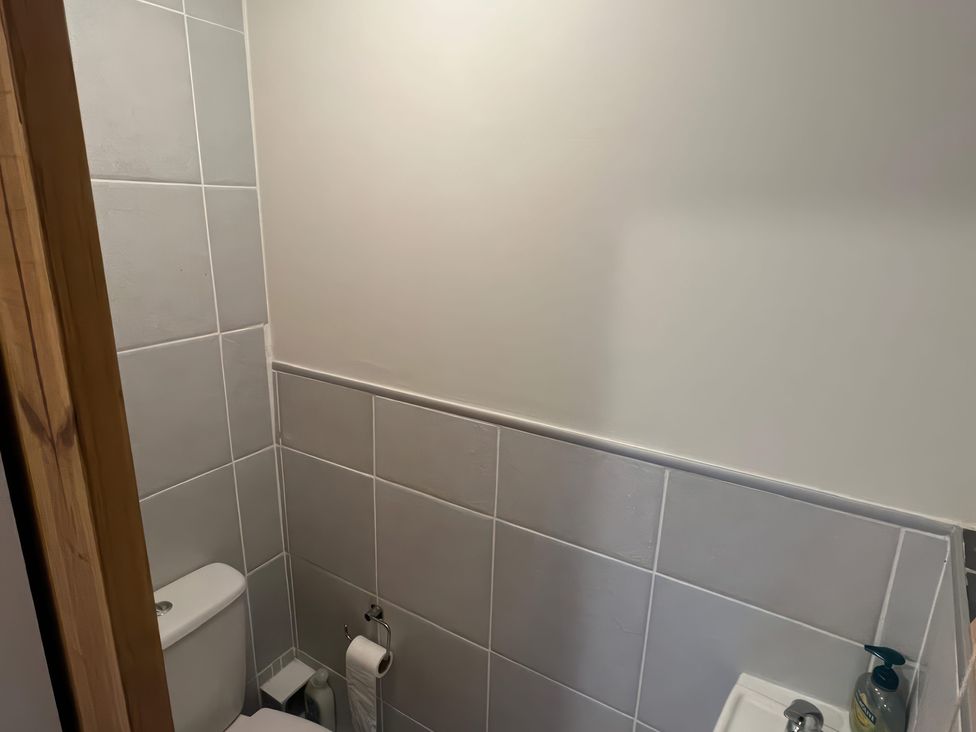 A bathroom with a toilet and sink at Sun House in Allonby