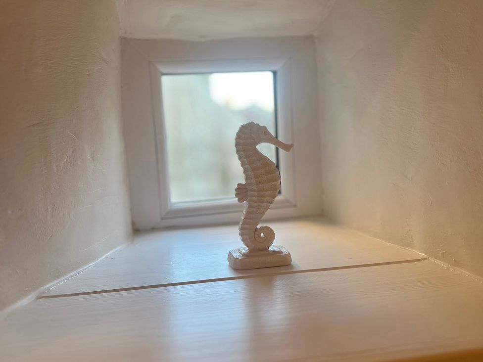A seahorse figurine on a windowsill at Sun House in Allonby