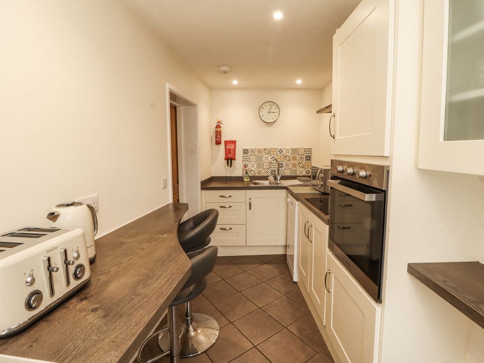 A kitchen with appliances and countertops at Sun House in Allonby