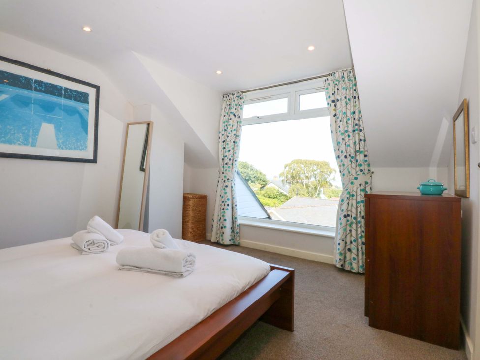 A bedroom with a bed and window at Swn Y Don in 