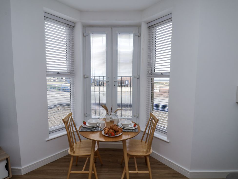A dining area with table and croissants at Apartment 2 Redcar
